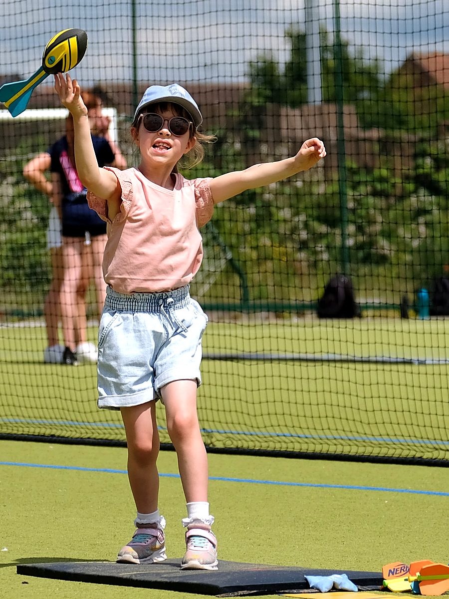 A young girl throwing a foam howler at a Vale of York Funetics session