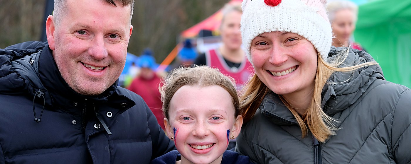 A Vale of York family at a winter cross country fixture, parents and daughter together