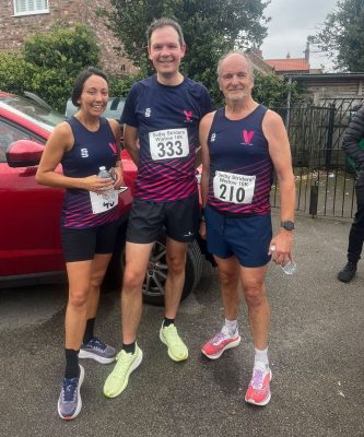 Colette Brear, Daniel Wigglesworth and Steve Middup in Vale of York vests before the Wistow 10K