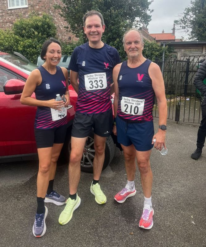 Colette Brear, Daniel Wigglesworth and Steve Middup in Vale of York vests before the Wistow 10K